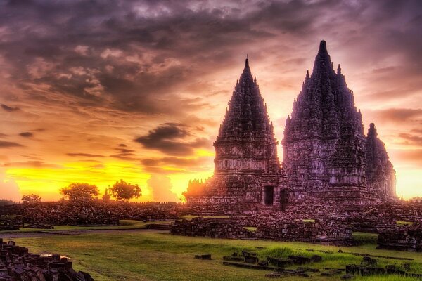 Temple at sunset on the background of clouds