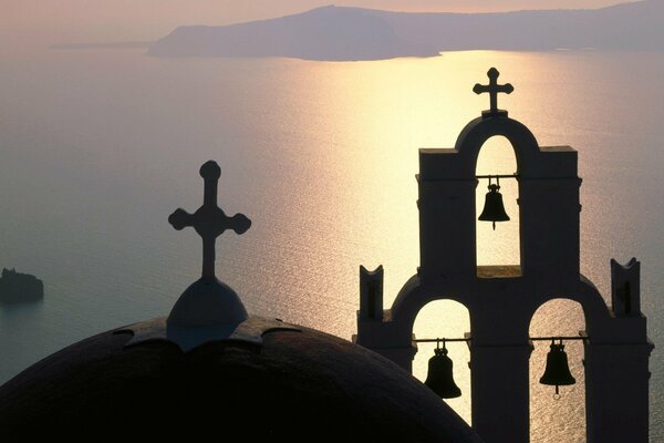 Silhouette of a bell tower on an island in Greece