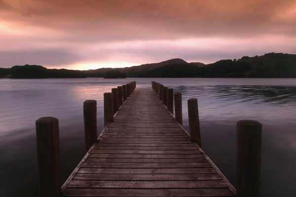 Pier on the background of a beautiful sunset