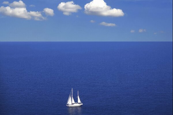 A lonely yacht on the blue sea