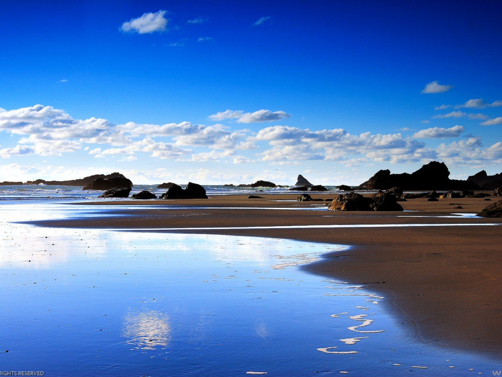 clouds stones beach