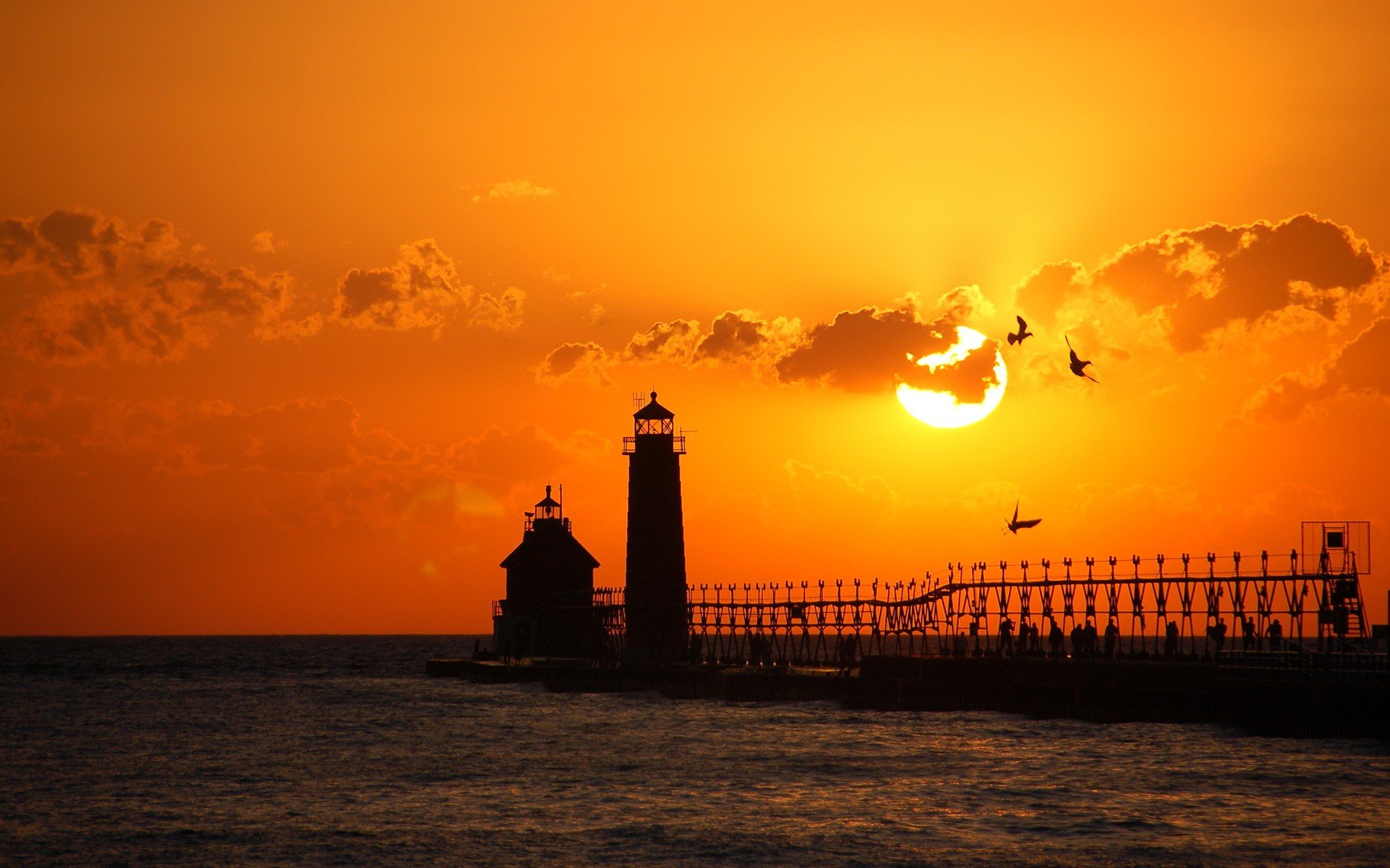 sonnenuntergang strand meer leuchtturm