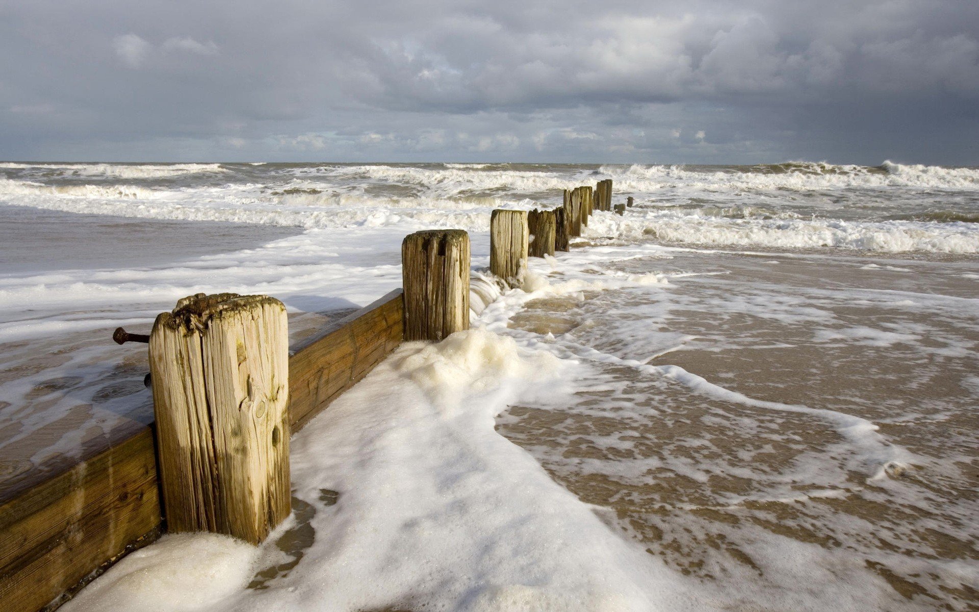 fence sea waves foam