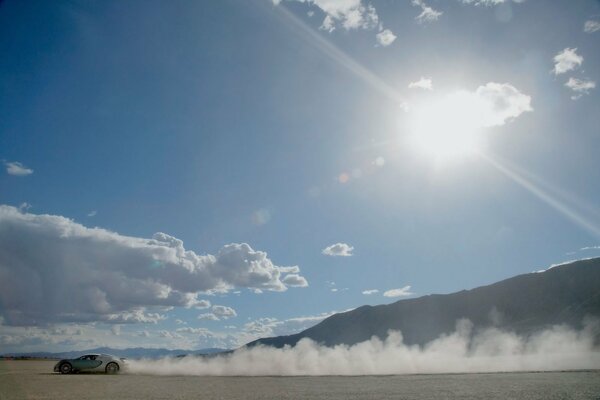 Bugatti rushes through the desert, kicking up dust