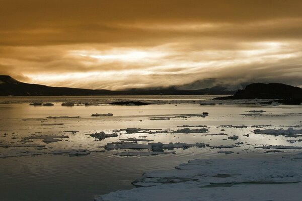 Ice on the river in winter, clouds