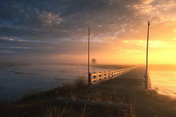 The road across the bridge leads forward