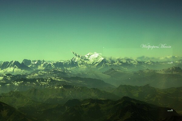 High mountains in a green fog