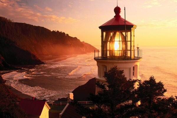 Oregon lighthouse on sunset background