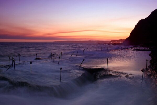 The harsh seashore at sunset