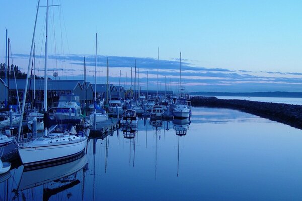 Yachts at the pier in the evening