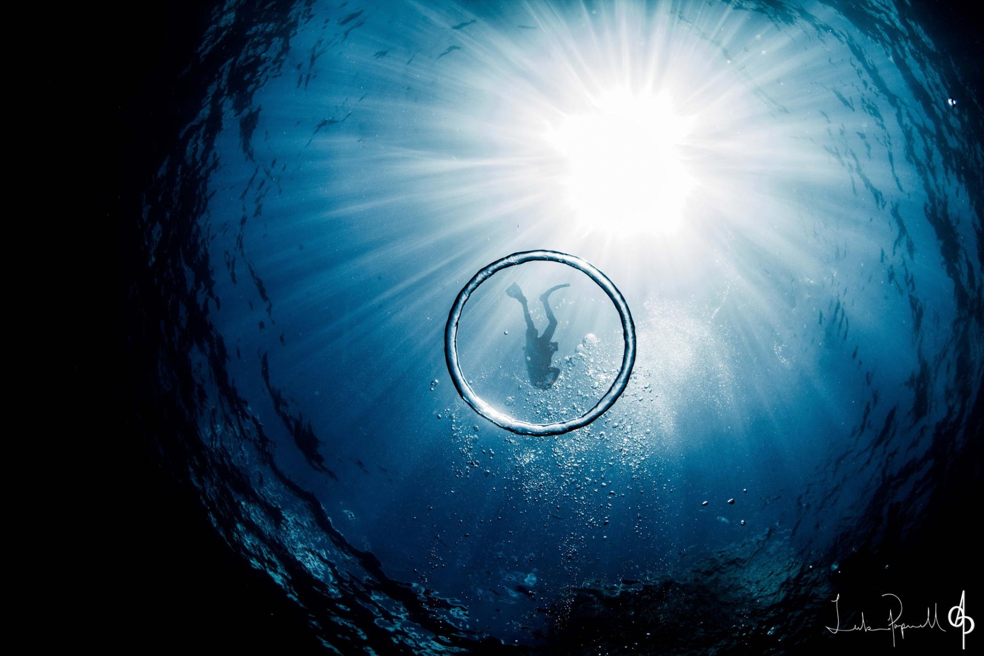 mare oceano luce uomo subacqueo cerchio