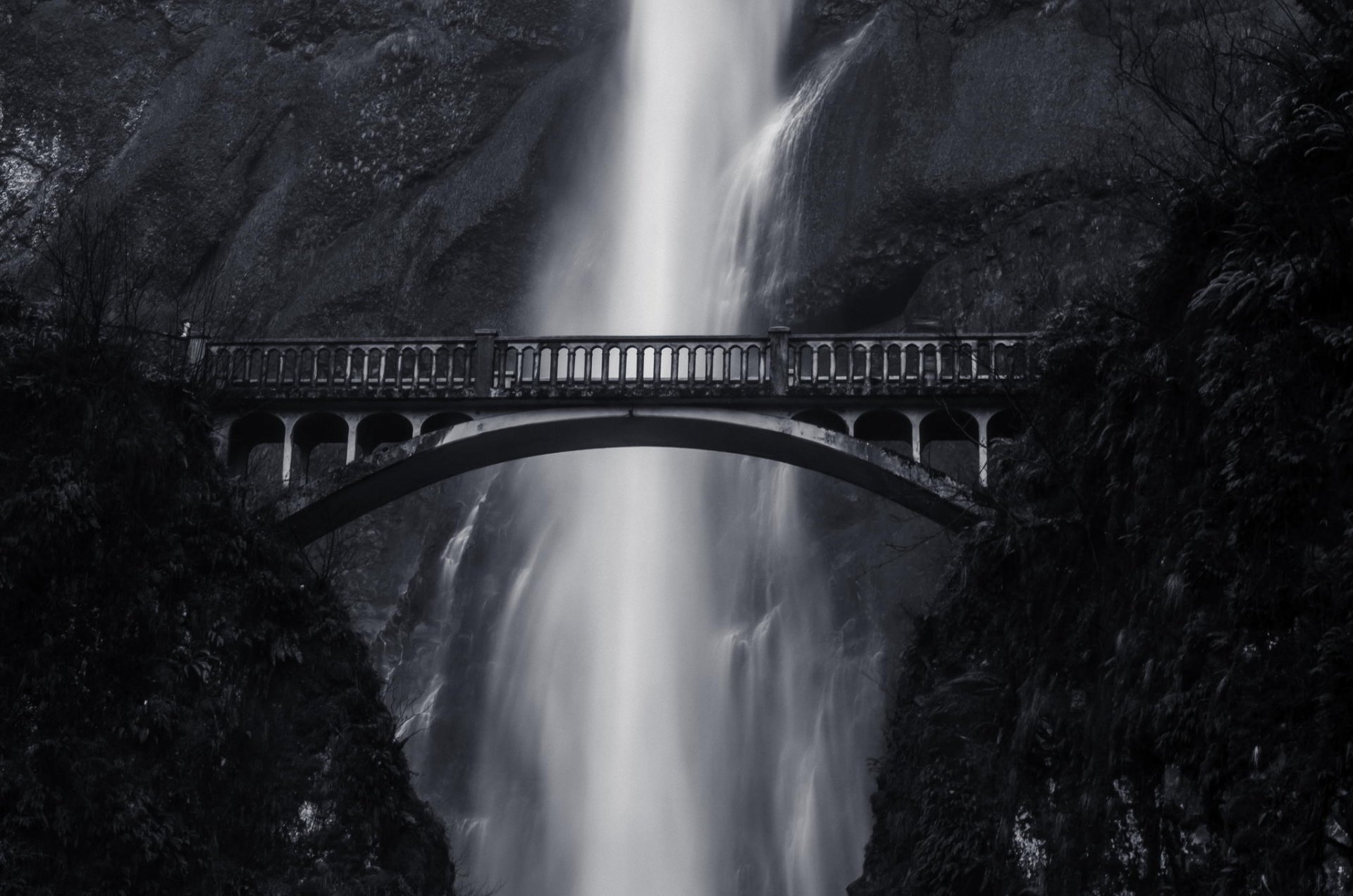 waterfall mountain bridge height black-and-white photo