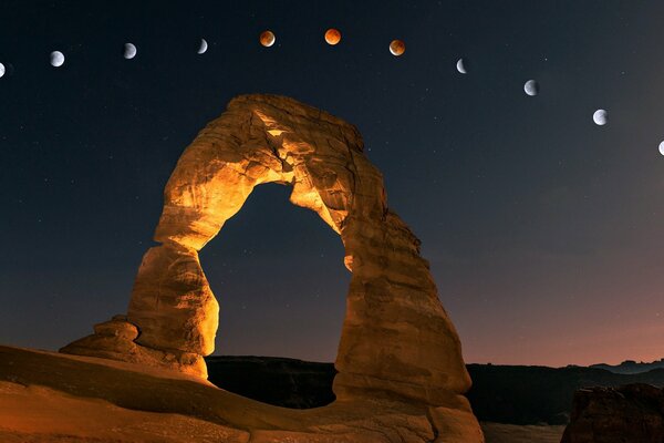 Against the background of the sky with planets, the stone arch