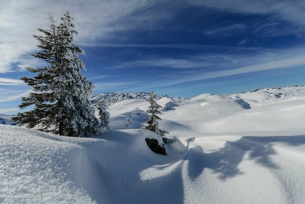 Snowy hills and blue sky