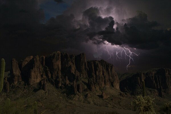 Stormy sky with lightning over the rocks