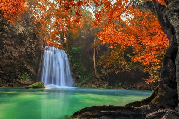 Waterfall in Thailand forms a clear blue lake