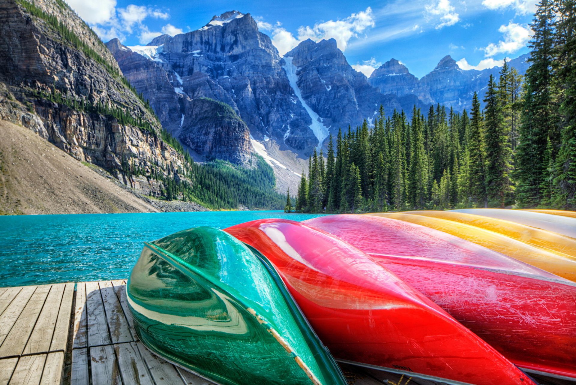 lake canada mountain forest canoes wharf