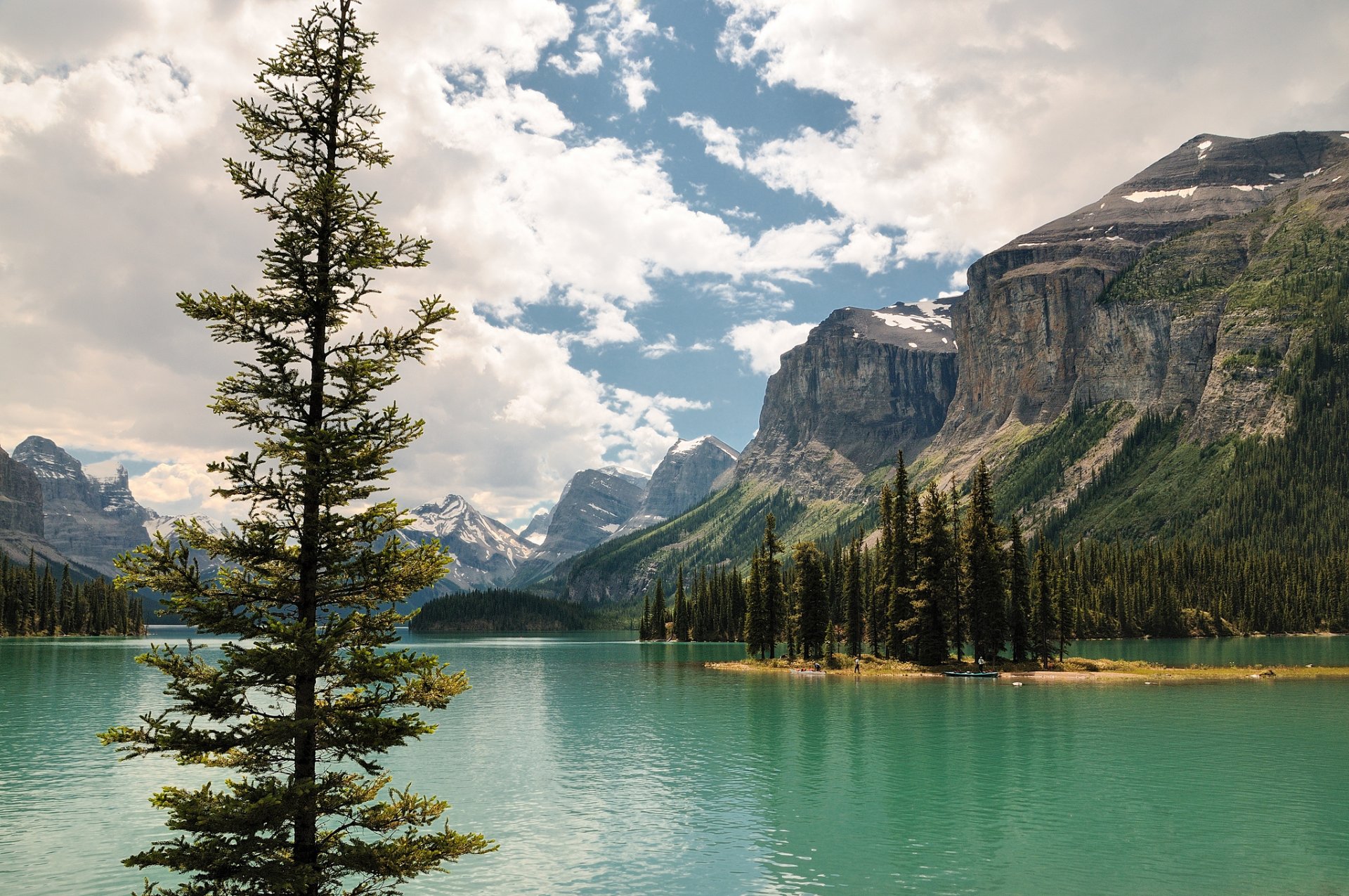 maligne lake jasper albert canada lake island tree mountain sky cloud