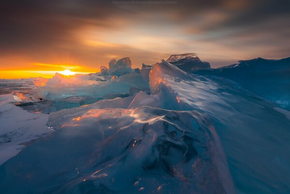 Icy mountains in the rays of the setting sun