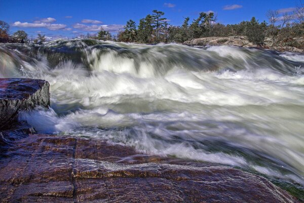 Raging and uncoordinated stream of water from the rocks