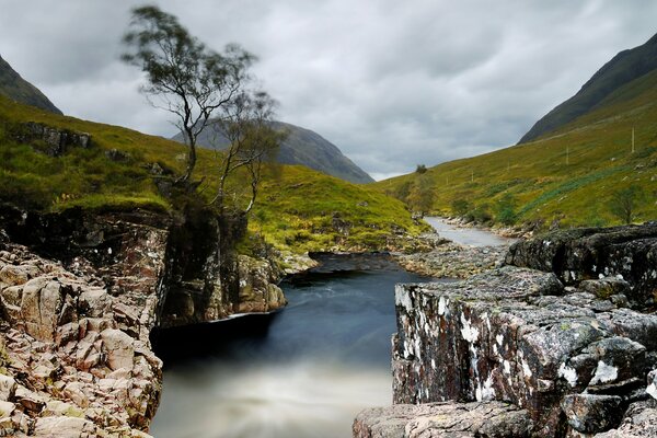 Mountain river flowing between the stones