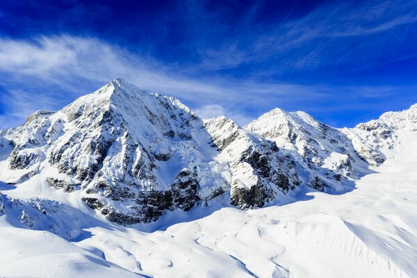 Sky and snow-covered mountain range