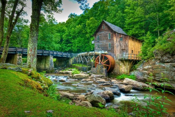 A rustic house with a watermill