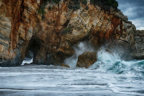 Storm at sea in the rocks