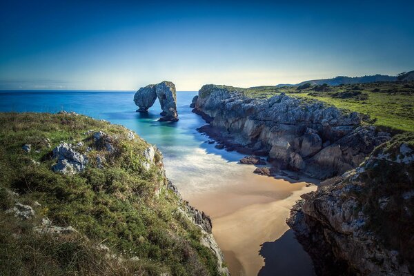 Beach on the coast among the mountains