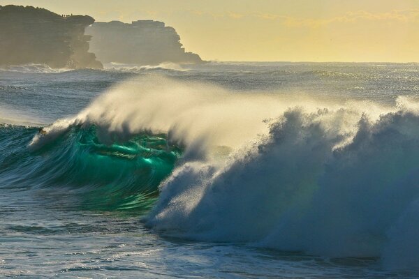 A wave hitting the rocks in the Pacific Ocean