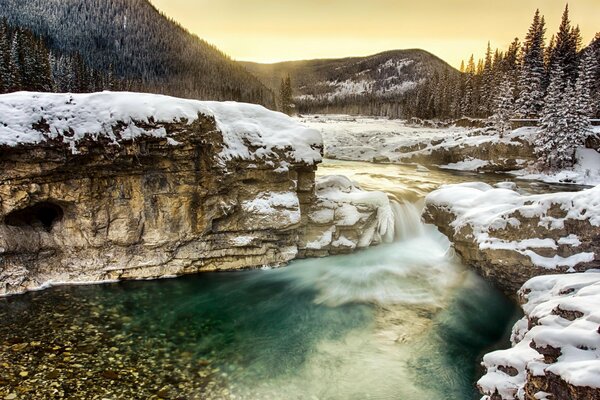 Morning, frozen mountain river