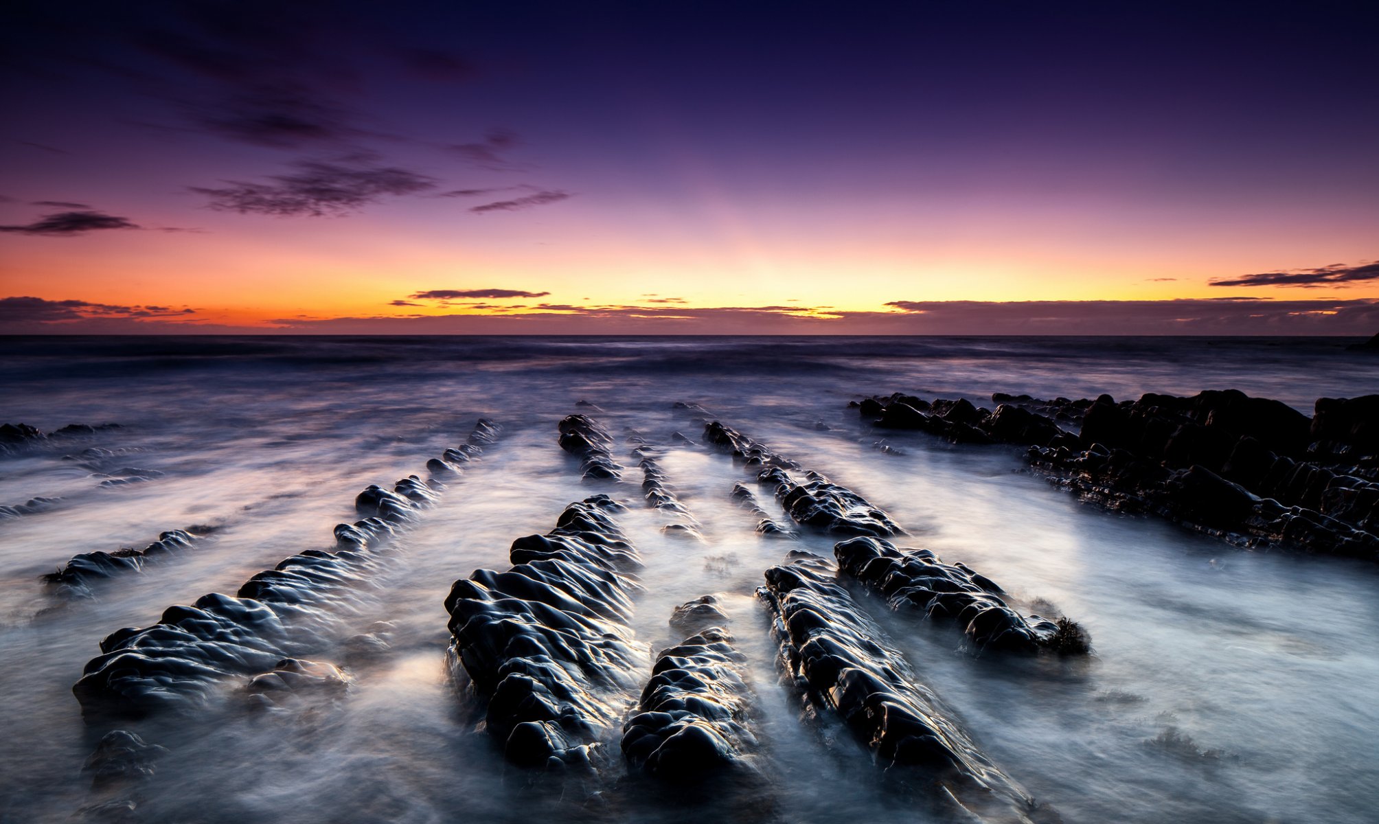 landscape dawn ocean sand stones beach rock