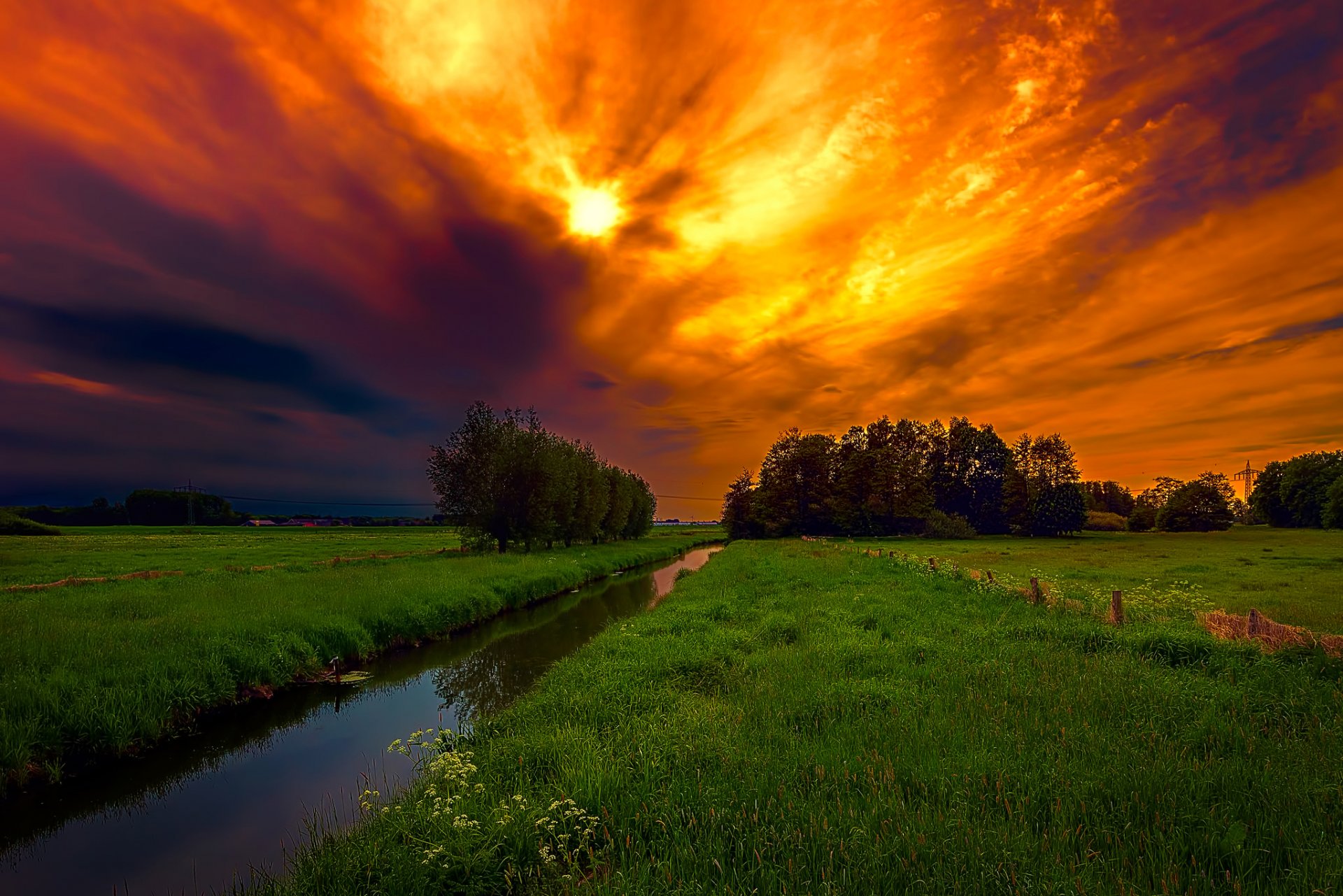 ky clouds glow the field grass channel creek tree