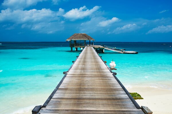 Pier on paradise beach. Perfect blue water