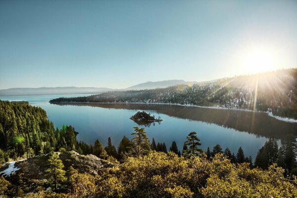 Landscape of mountains and forests by the lake