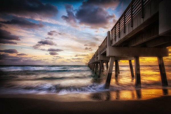 The mysterious beginning of a new day at the sea pier