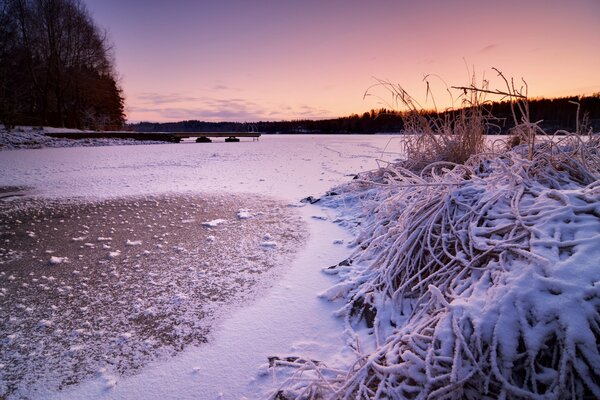 Frozen pier, wrapped in a blanket of snow