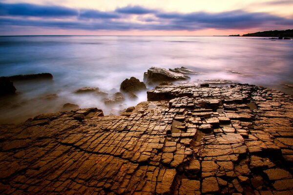 Cracked stones in the evening fog