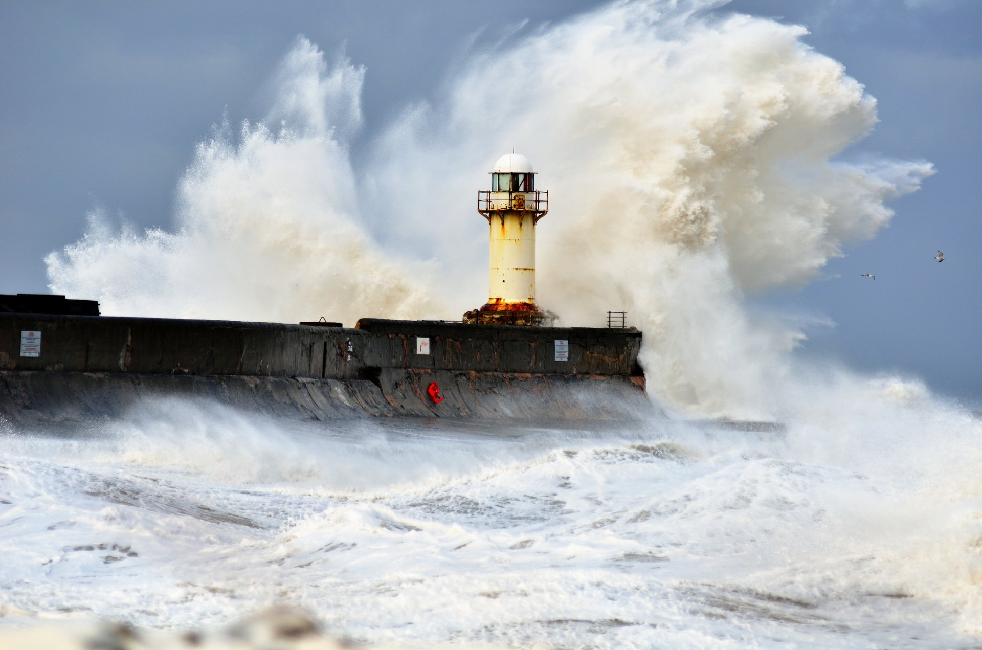 ea lighthouse waves spray storm