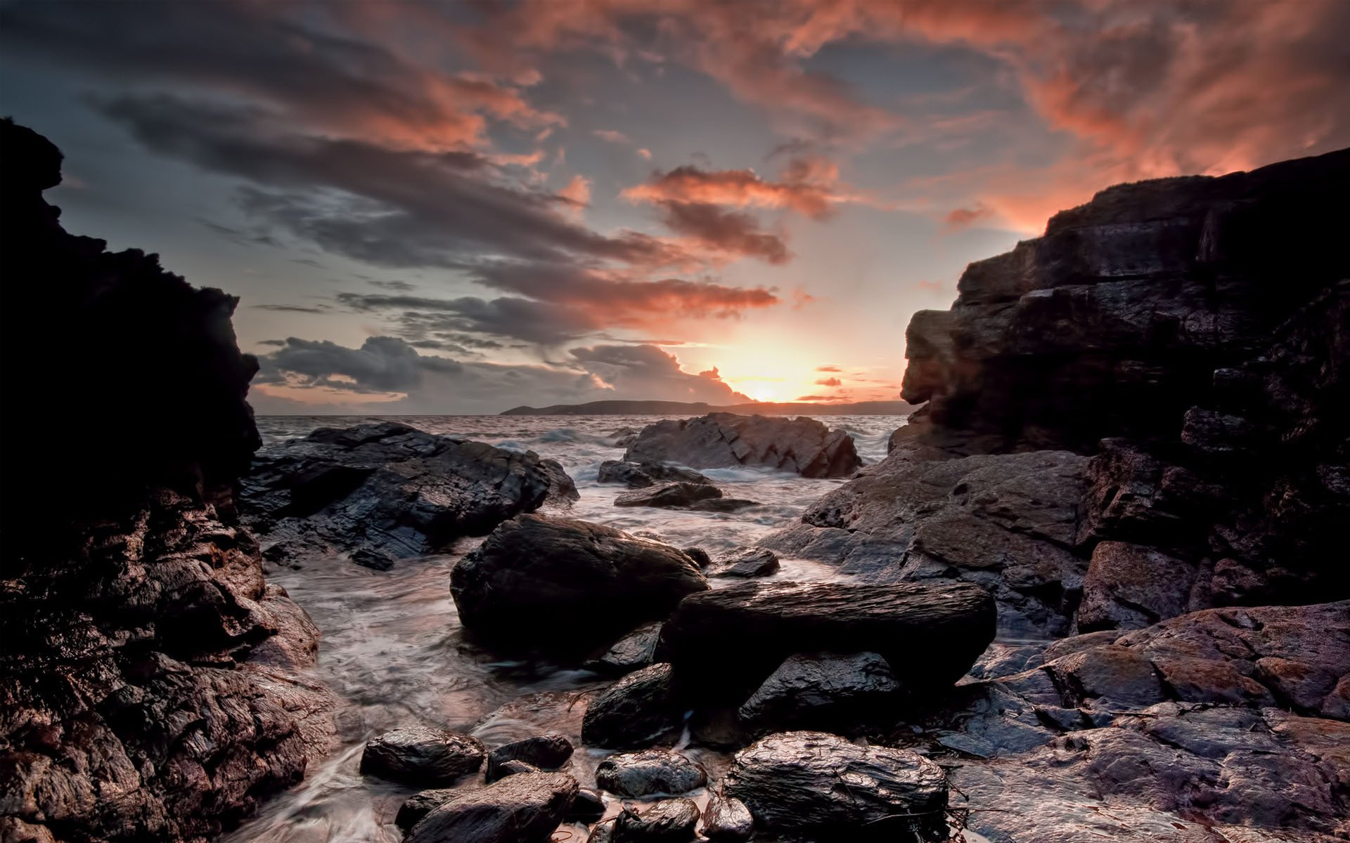 mar rocas rocas puesta de sol nubes nubes