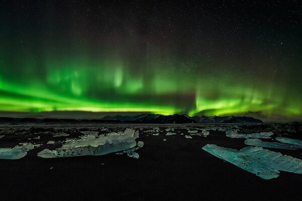 Northern Lights in the distance mountains