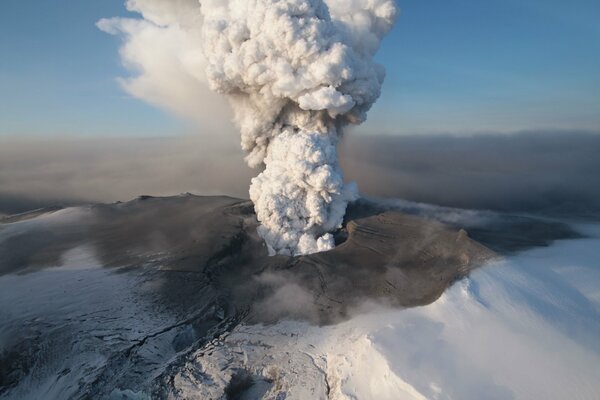 A large eruption of a volcano with gray ash