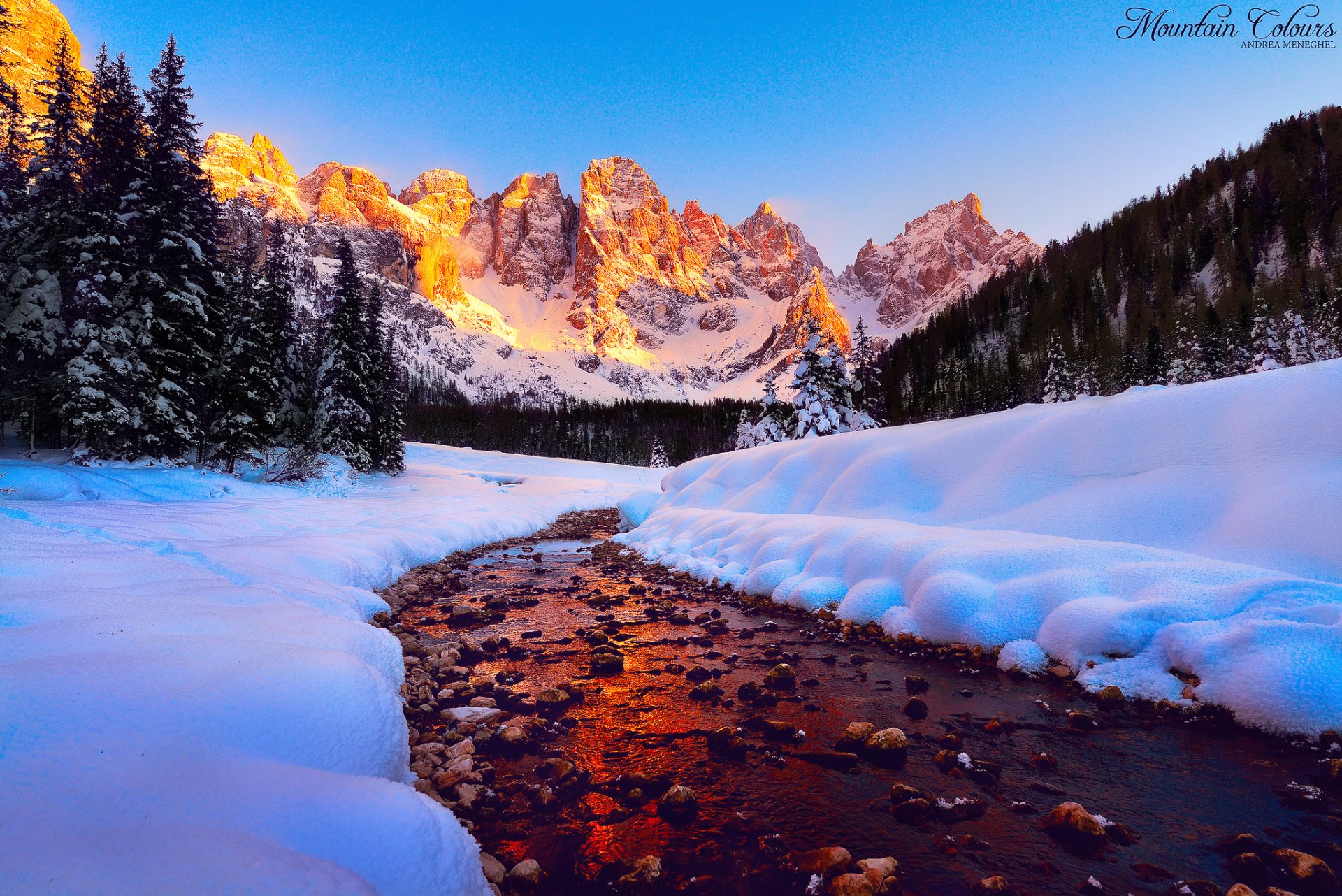 dolomites mountain tops light sky forest river snow