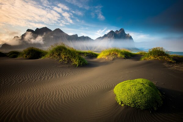 Icelandic mountains , sand and sea