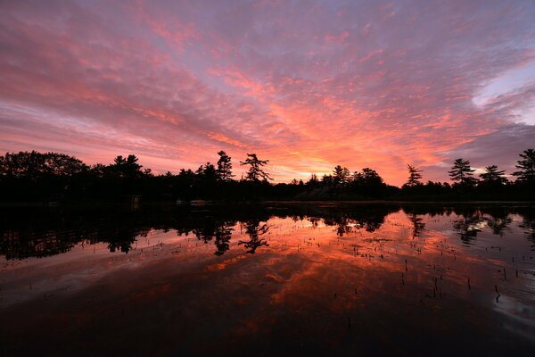 Orange sunset on cloudy sky in canada