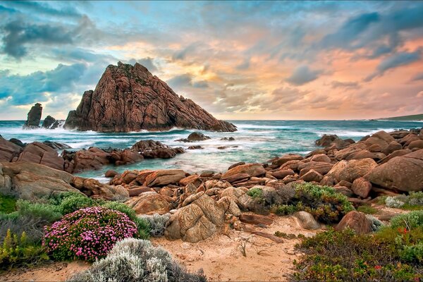 The rocky shore of the blue ocean