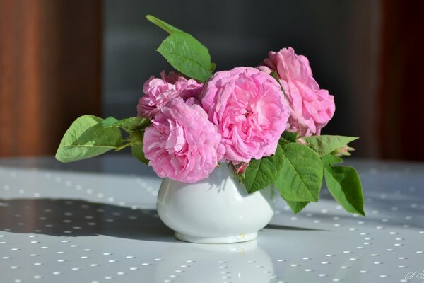 Vase with a bouquet of pink flowers