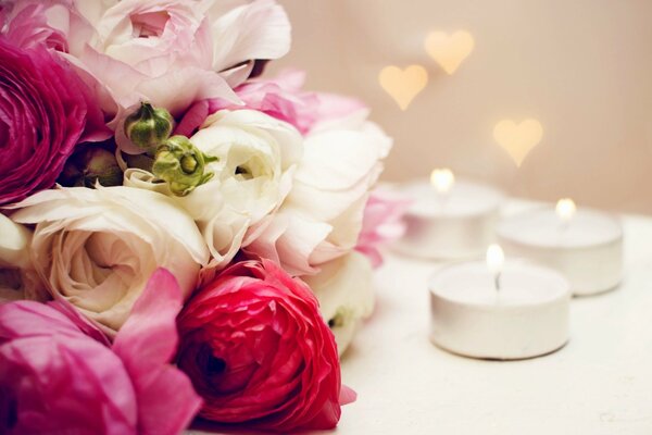 Romantic composition with flowers and candles