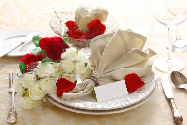 Wedding decorated table with white and red roses