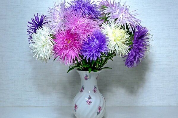 Autumn is the time of asters, a bouquet in a porcelain vase